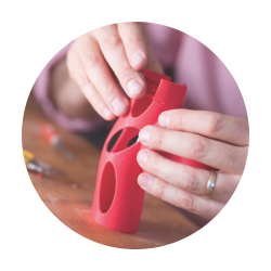 Closeup shot of a design student working on a plastic sculpture