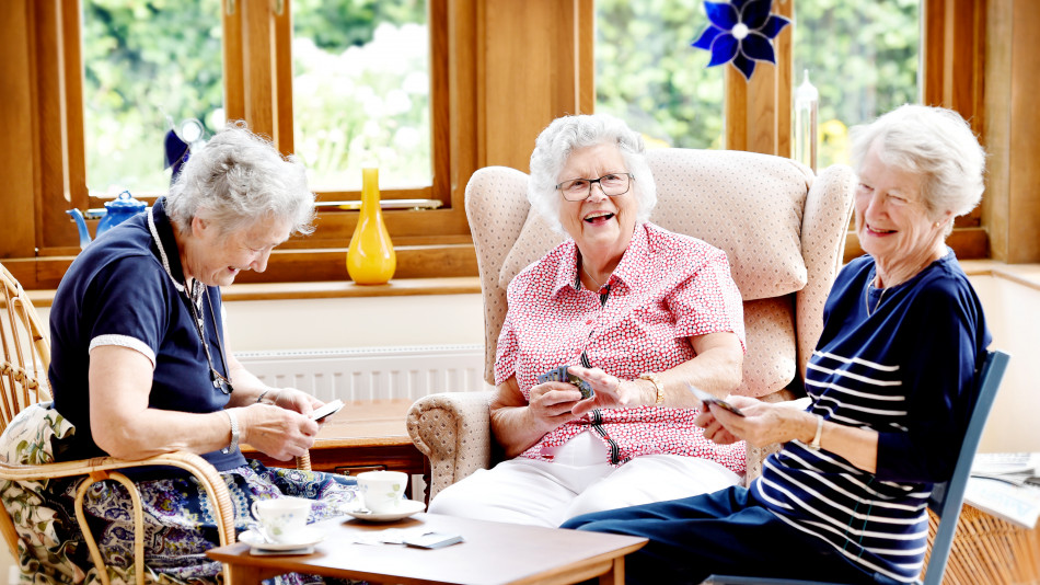 Older People Playing Cards Radfield Home Care all rights reserved